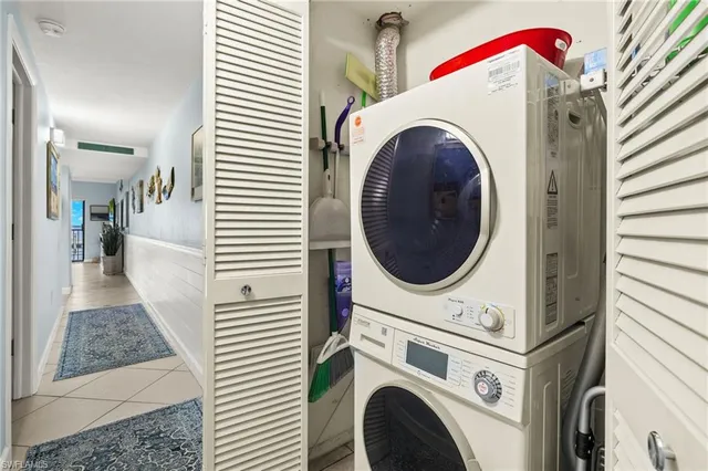 a view of a chair and tables in the balcony