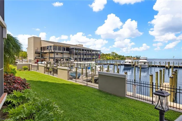 a view of swimming pool with a table and chairs