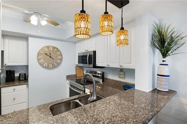 a very nice looking kitchen with cabinets