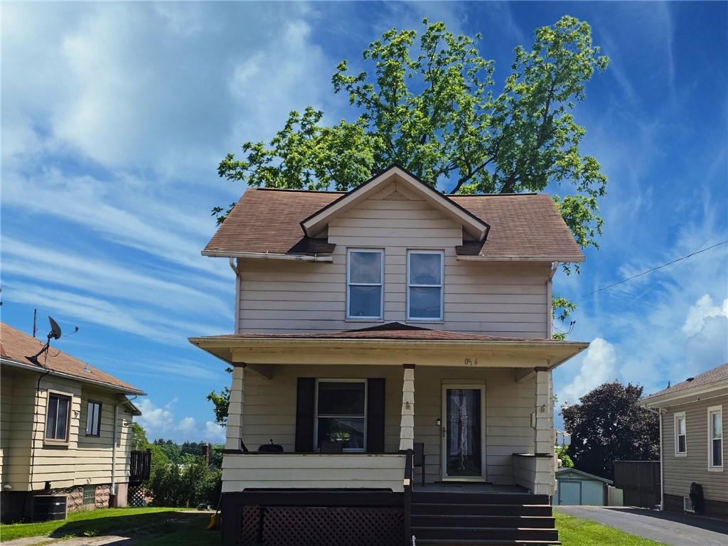 1056 Adams Street New Castle, PA 16101 - Photo 1 of 21 a front view of a house with a yard