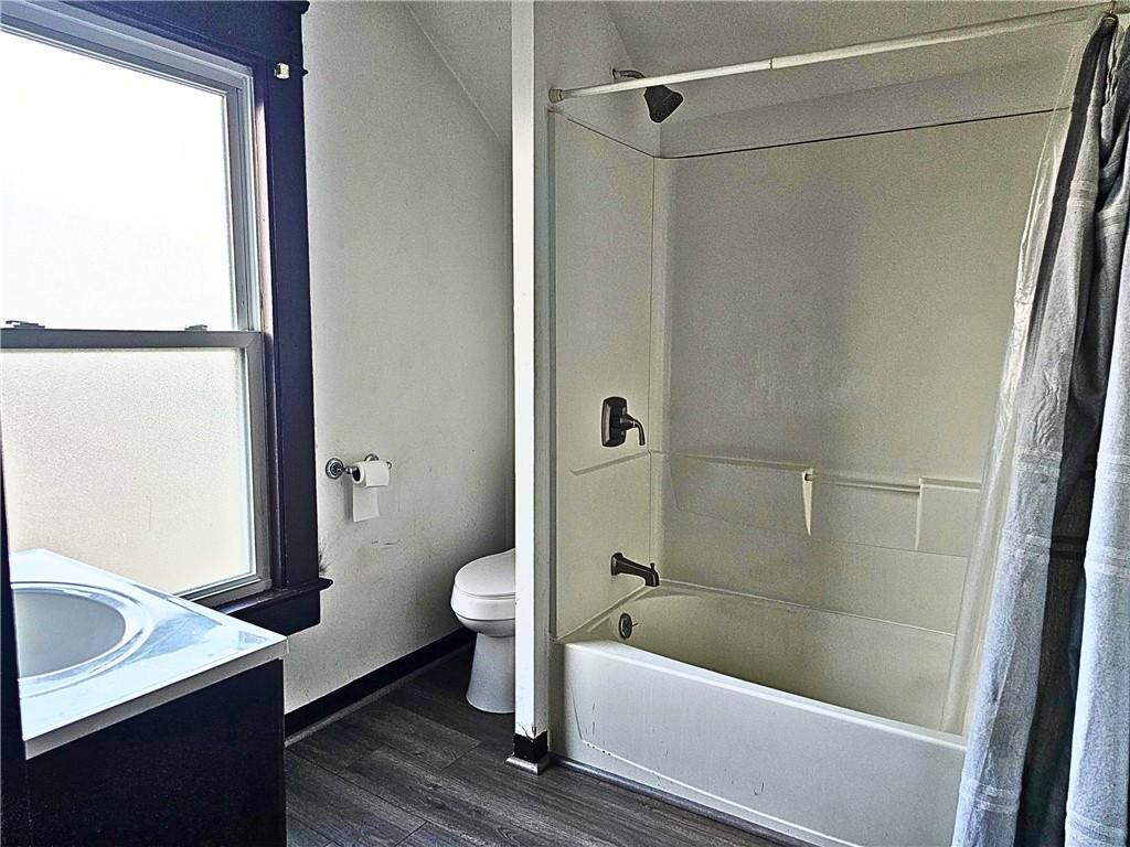 1056 Adams Street New Castle, PA 16101 - Photo 19 of 21 a bathroom with a sink a toilet and shower