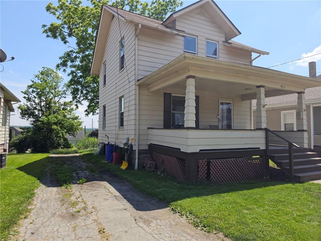 1056 Adams Street New Castle, PA 16101 - Photo 2 of 21 front view of a house with a yard
