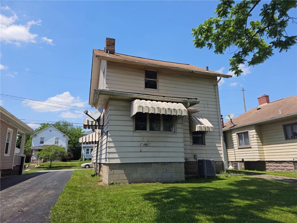 1056 Adams Street New Castle, PA 16101 - Photo 3 of 21 a front view of a house with a garden