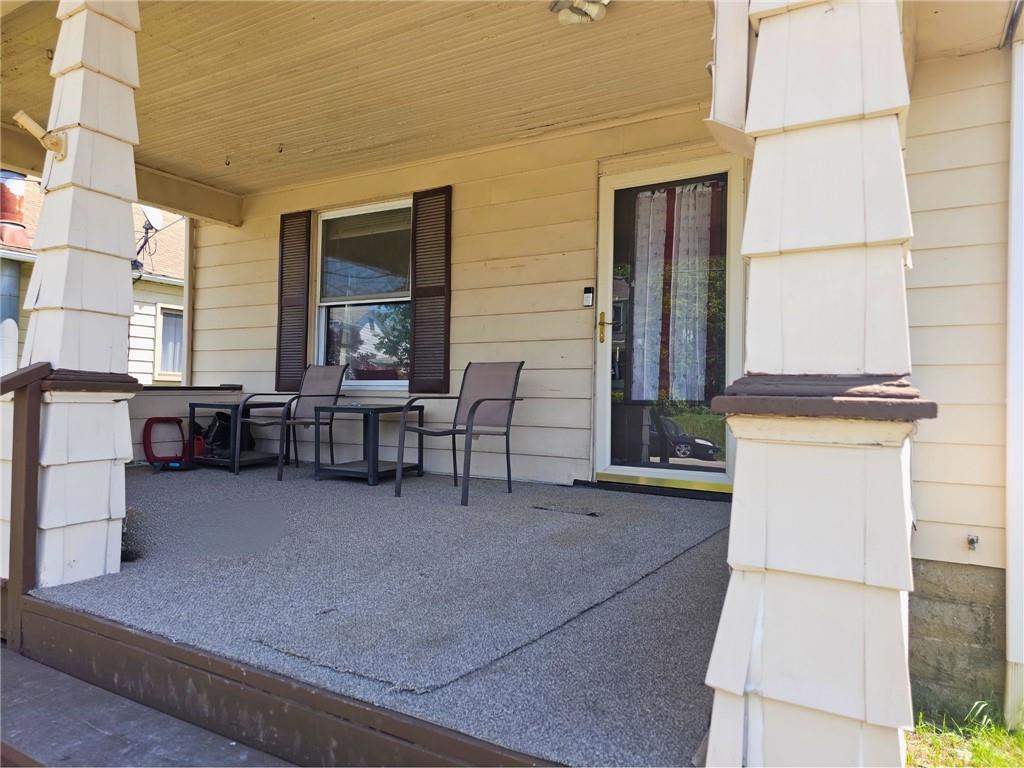 1056 Adams Street New Castle, PA 16101 - Photo 6 of 21 a view of a patio with table and chairs