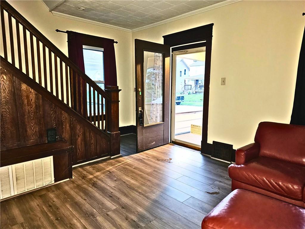 1056 Adams Street New Castle, PA 16101 - Photo 7 of 21 a view of livingroom with furniture and wooden floor