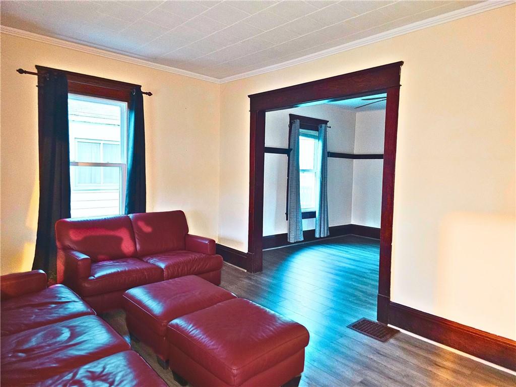 1056 Adams Street New Castle, PA 16101 - Photo 8 of 21 a living room with furniture and a window