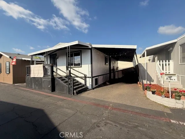 a view of a small space with wooden floor and a window