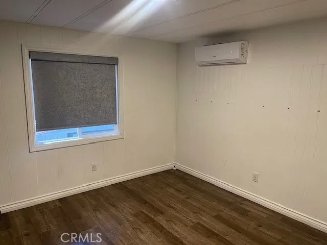 a kitchen with a sink dishwasher and white cabinets
