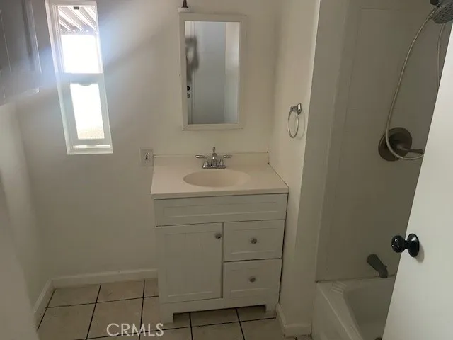 a bathroom with a toilet sink and shower