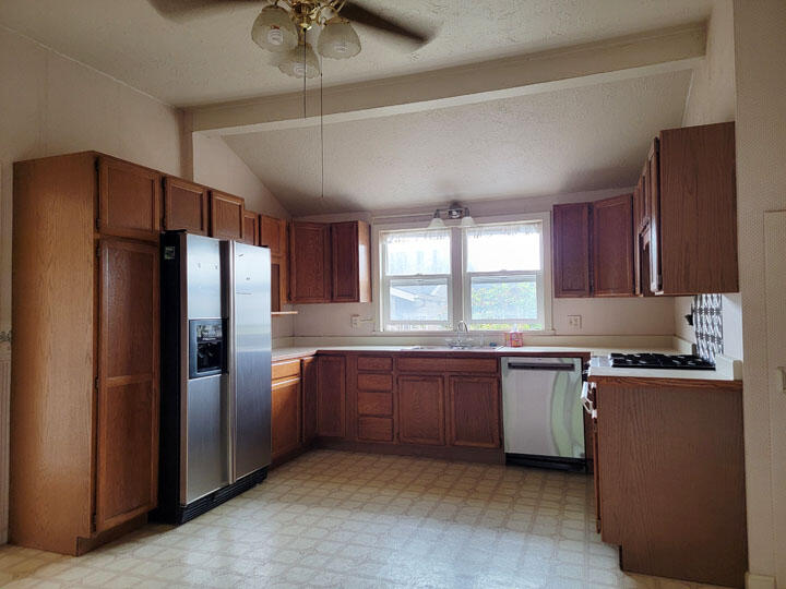 120 13th Street Arcata, CA 95521 - Photo 8 of 37 a kitchen with stainless steel appliances granite countertop a refrigerator a sink a stove a microwave a counter space and cabinets
