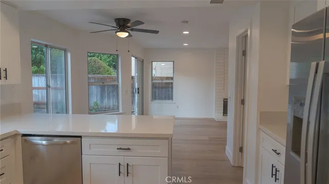a kitchen with a refrigerator and a microwave