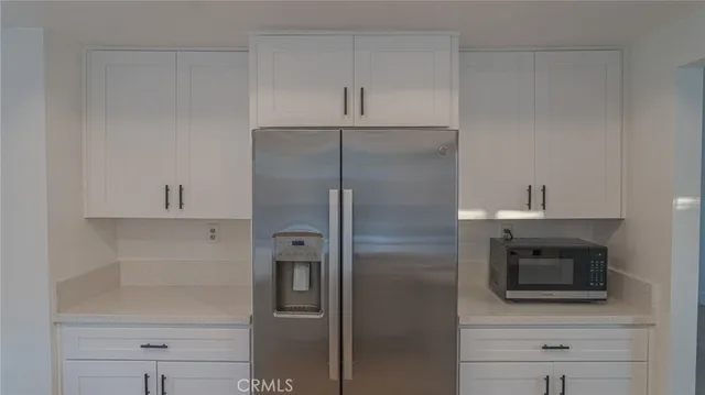 an empty room with a empty space and windows