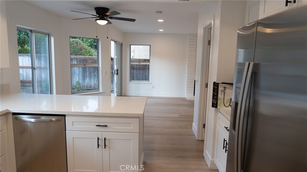 21 Fillmore Irvine, CA 92620 - Photo 15 of 24 a kitchen with a refrigerator and a sink