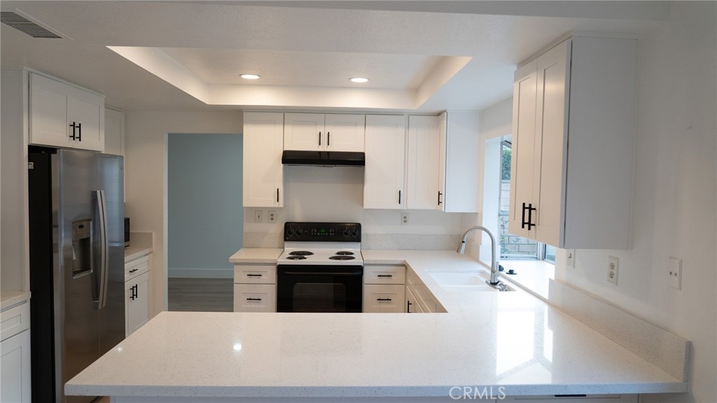 21 Fillmore Irvine, CA 92620 - Photo 17 of 24 a kitchen that has a sink and a stove