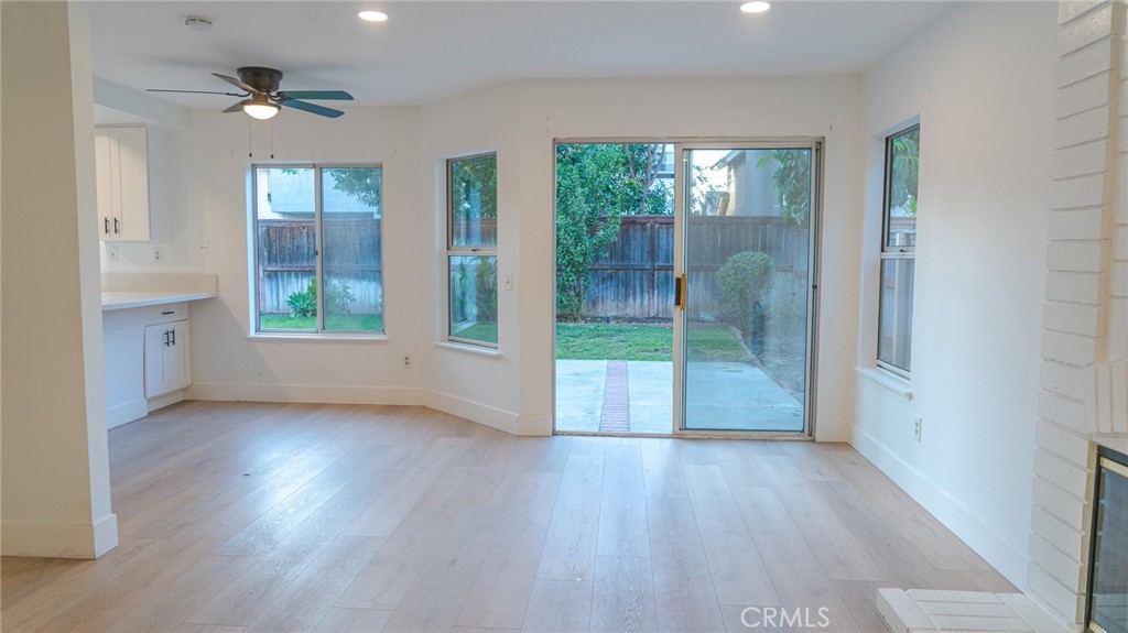 21 Fillmore Irvine, CA 92620 - Photo 19 of 24 an empty room with wooden floor and a floor to ceiling window