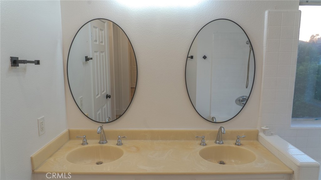 21 Fillmore Irvine, CA 92620 - Photo 20 of 24 a bathroom with a sink and a mirror