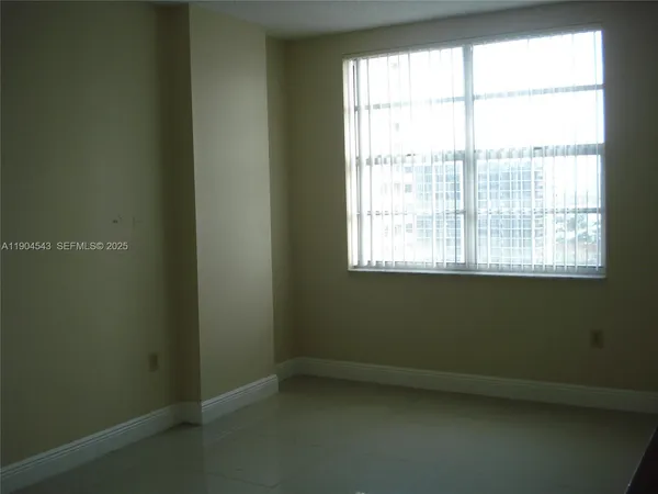 a kitchen with white cabinets and a sink