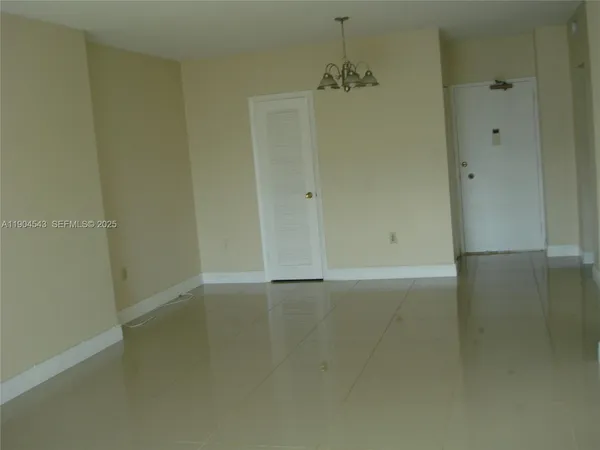 a room that has a dresser in it
