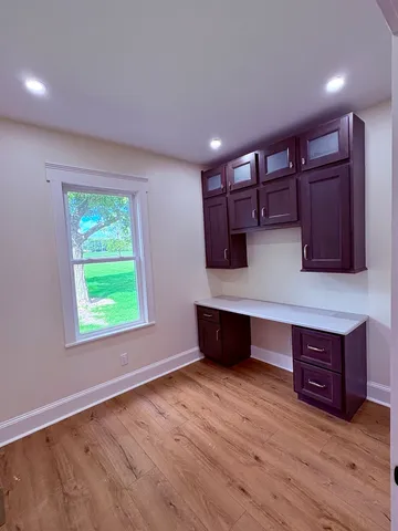 a view of room with furniture and window