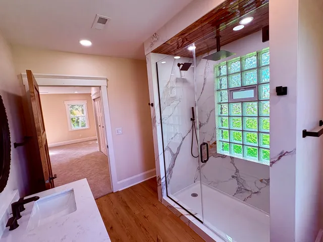 a view of entryway with a bathtub and door