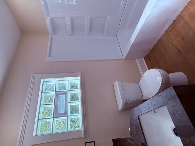 a view of entryway with microwave and window