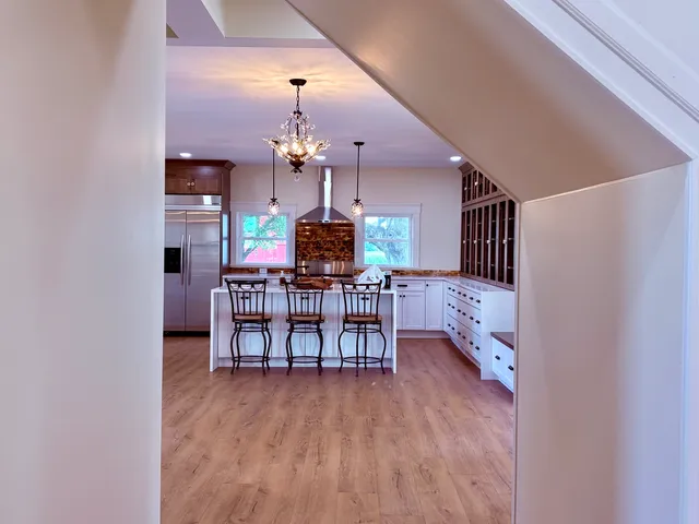 a dining room with furniture and chandelier