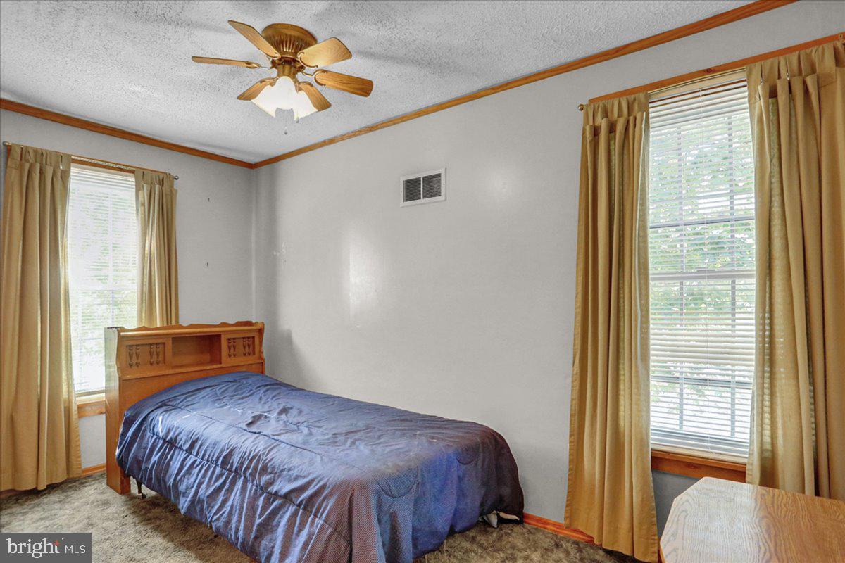 32 2nd Street Shillington, PA 19607 - Photo 11 of 26 a bedroom with a bed and a window
