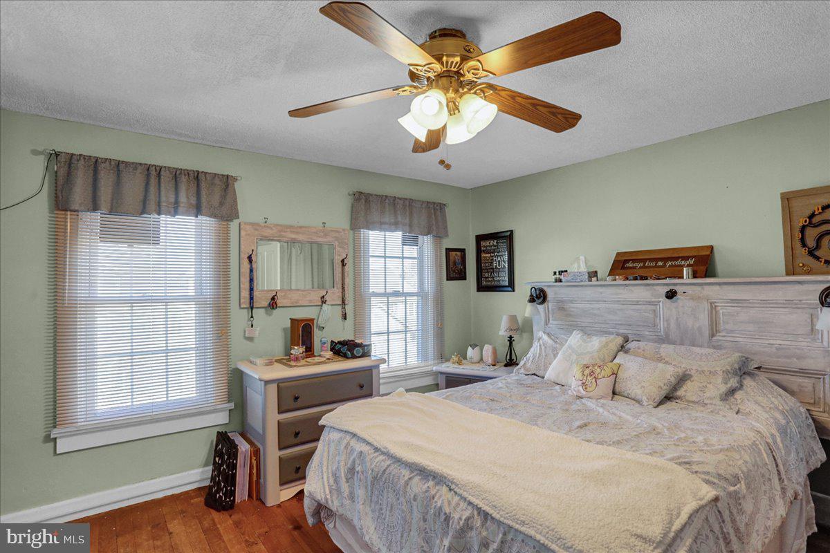 32 2nd Street Shillington, PA 19607 - Photo 15 of 26 a bedroom with a bed and a chandelier