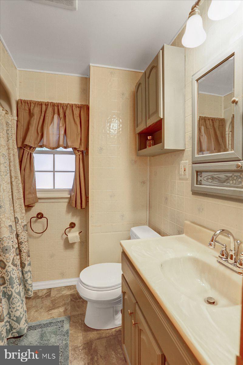 32 2nd Street Shillington, PA 19607 - Photo 19 of 26 a bathroom with a sink a toilet and shower