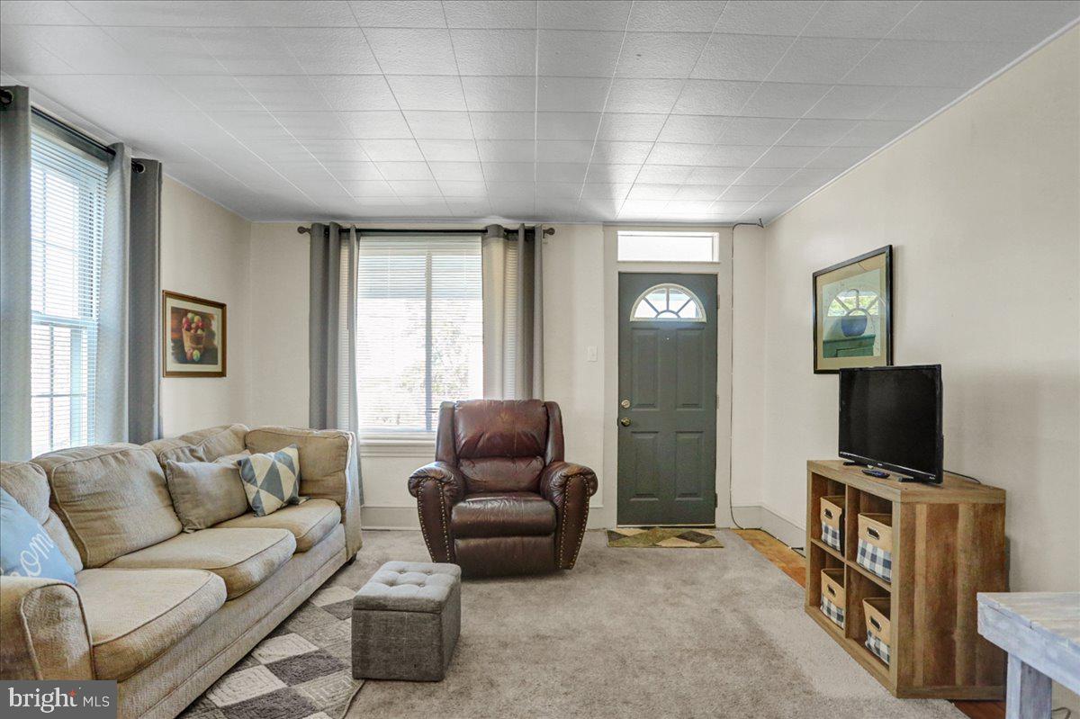 32 2nd Street Shillington, PA 19607 - Photo 4 of 26 a living room with furniture and a flat screen tv