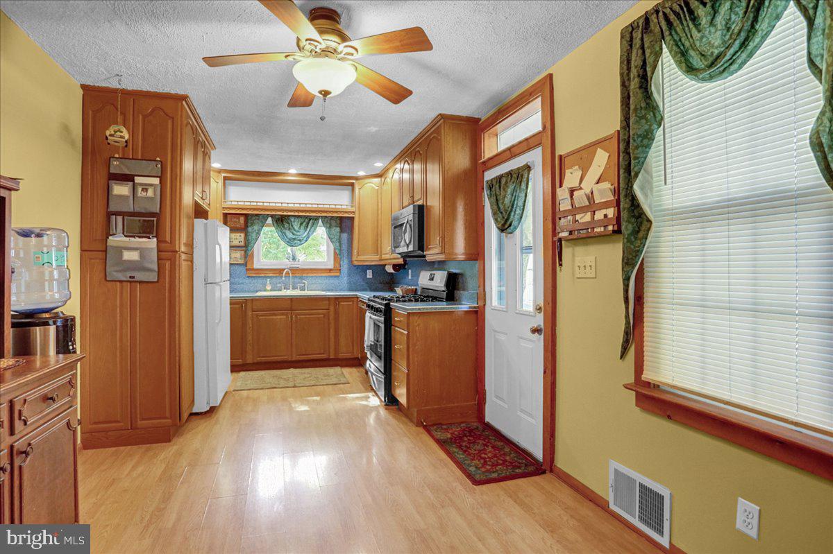 32 2nd Street Shillington, PA 19607 - Photo 8 of 26 a view of a kitchen cabinets and wooden floor