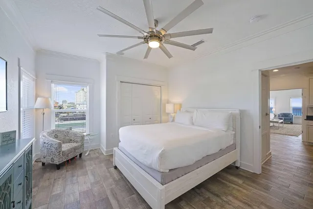 a bedroom with a large bed and a window