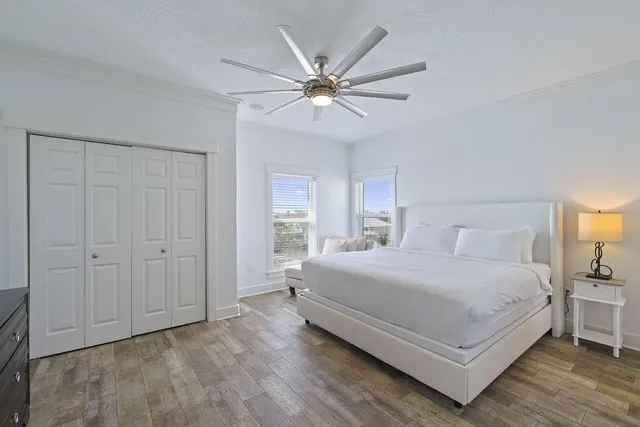 a bedroom with a large bed and a window