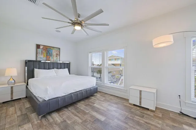a bathroom with a granite countertop sink toilet a mirror and shower