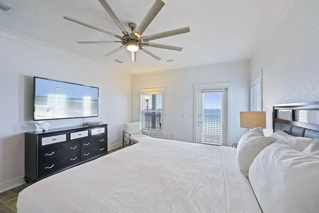 a bedroom with a large bed and a couch