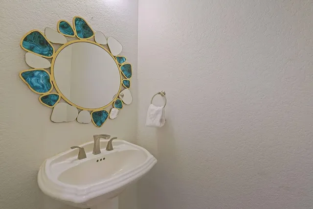 a dining room filled chandelier and dining table