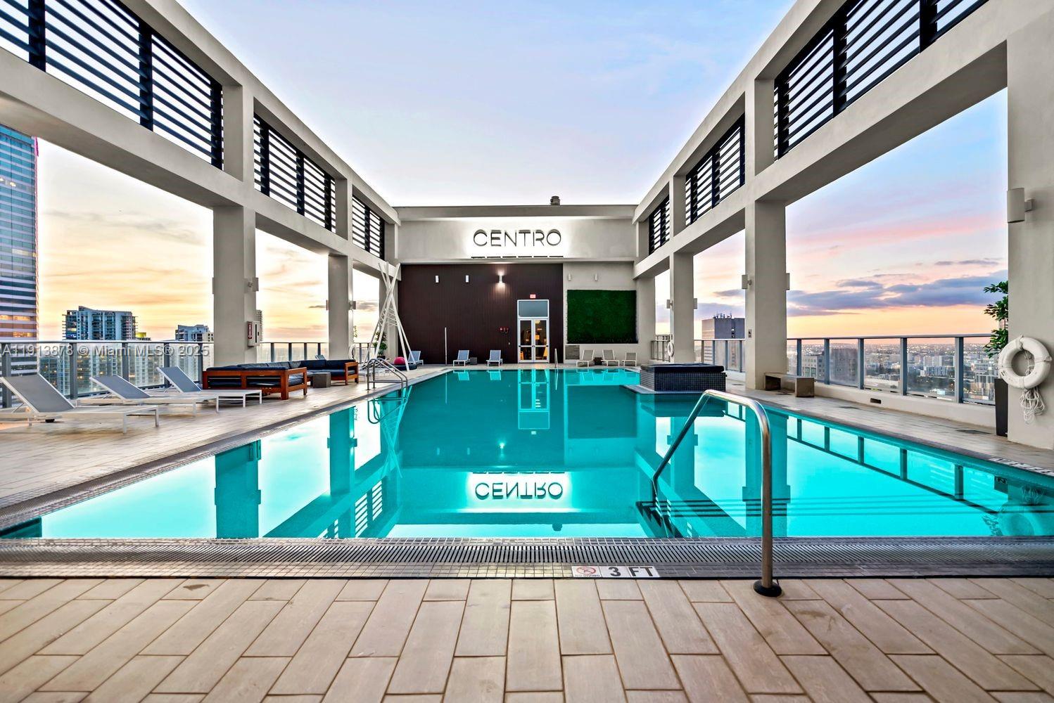 151 Southeast 1st Street, Unit 502 Miami, FL 33131 - Photo 13 of 21 a view of a swimming pool with a porch