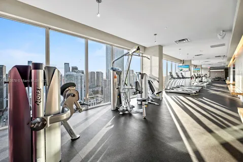 a view of a hallway to a window