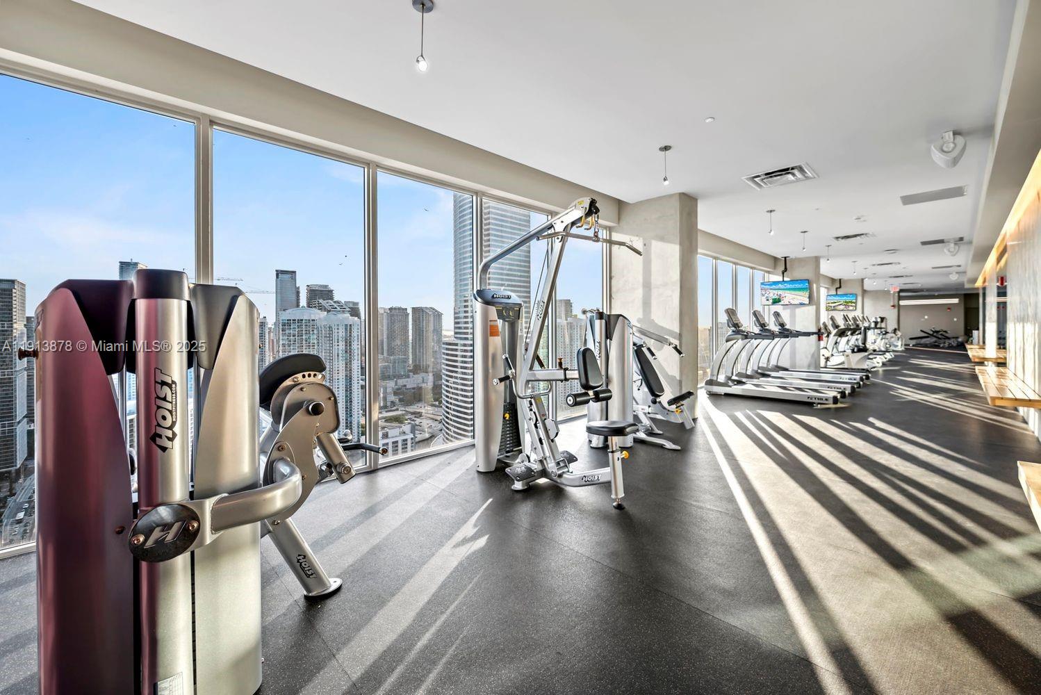 151 Southeast 1st Street, Unit 502 Miami, FL 33131 - Photo 17 of 21 a view of a room with gym equipment