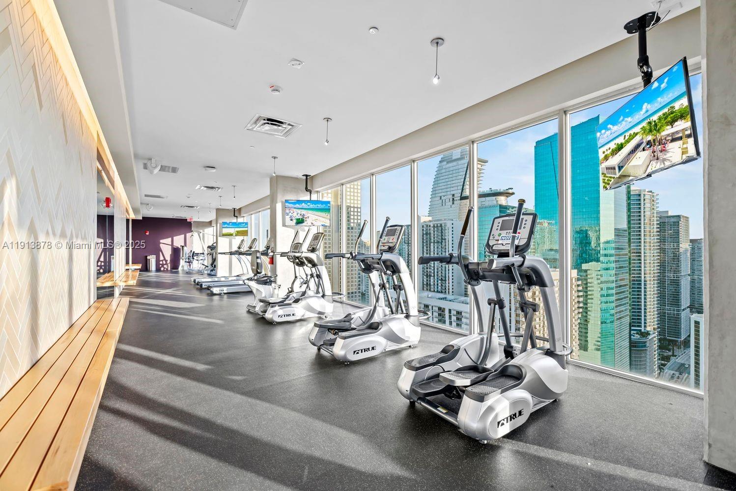 151 Southeast 1st Street, Unit 502 Miami, FL 33131 - Photo 18 of 21 a view of a room with gym equipment