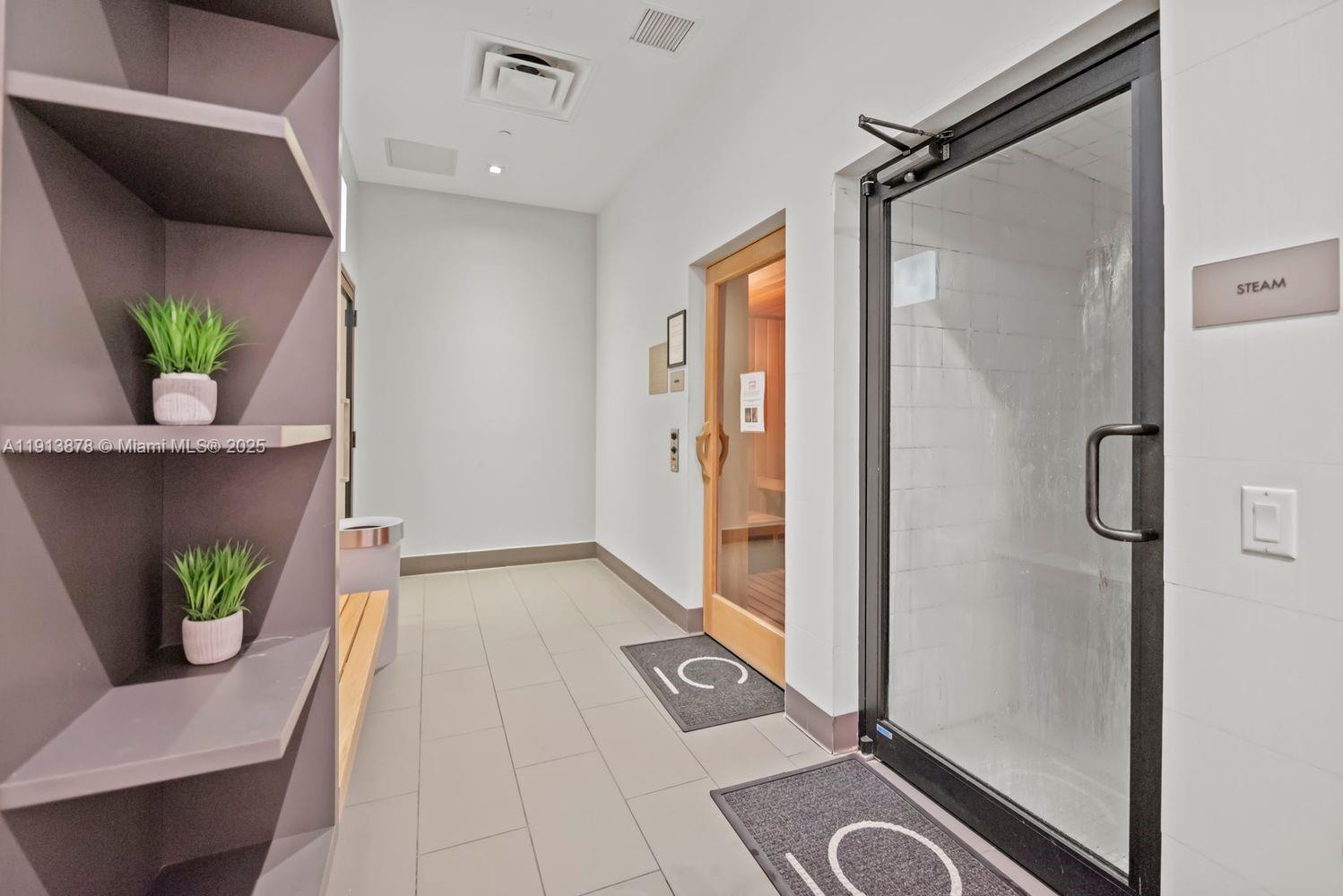 151 Southeast 1st Street, Unit 502 Miami, FL 33131 - Photo 19 of 21 a view of a hallway to a window
