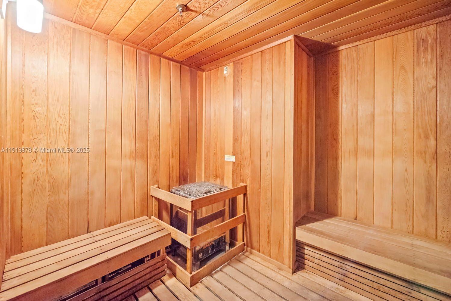 151 Southeast 1st Street, Unit 502 Miami, FL 33131 - Photo 20 of 21 a view of a bedroom with wooden floor and furniture