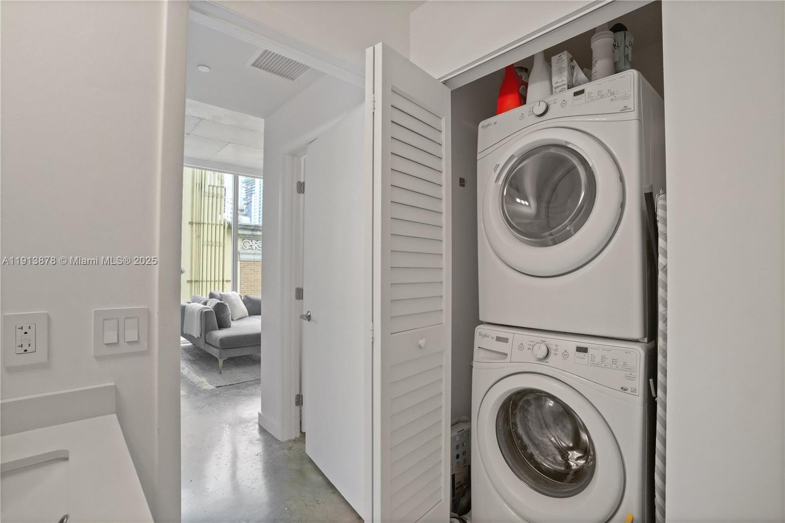 151 Southeast 1st Street, Unit 502 Miami, FL 33131 - Photo 9 of 21 a view of a hallway with washer and dryer