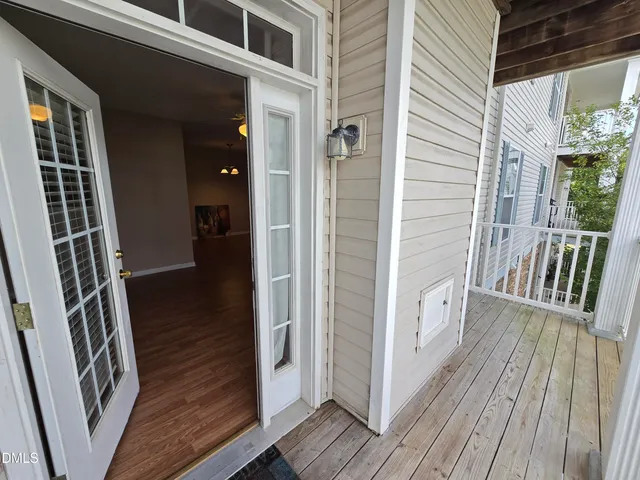 a view of balcony with wooden floor and stairs