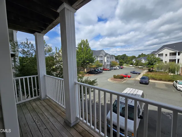 a view of car parked from a balcony