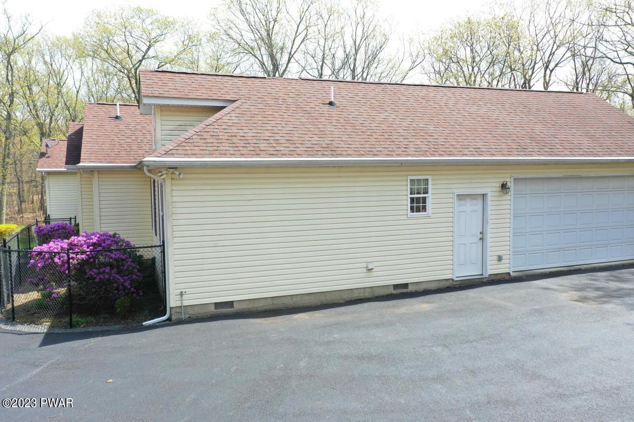 131 Maple Ridge Road Milford, PA 18337 - Photo 41 of 54 a view of a house with a yard