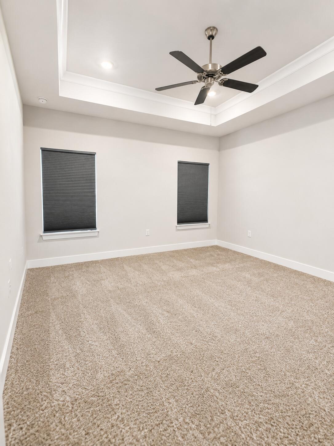 734 Quintana Street Crestview, FL 32539 - Photo 10 of 16 en empty room with fan and a ceiling fan