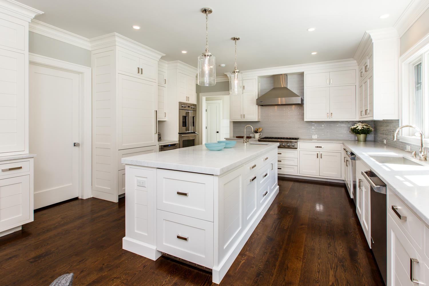 75 Parish Road New Canaan, CT 06840 - Photo 11 of 30 a kitchen with a sink stove and cabinets