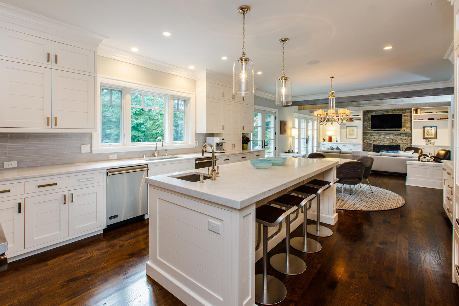 75 Parish Road New Canaan, CT 06840 - Photo 12 of 30 a kitchen with a sink a center island a counter space and a window