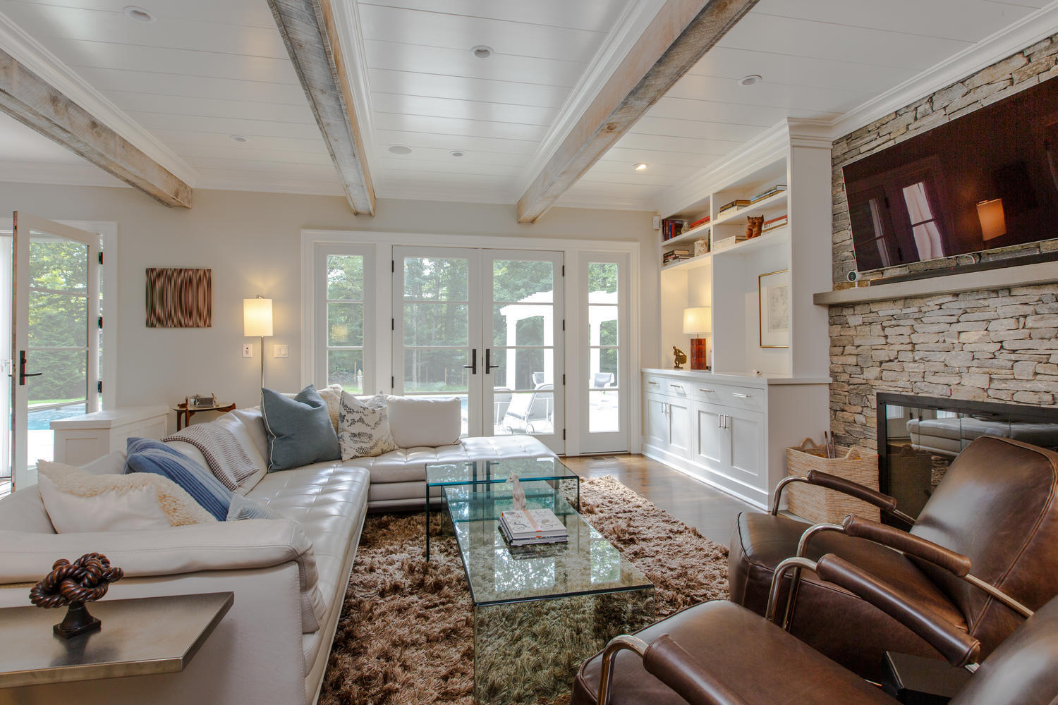 75 Parish Road New Canaan, CT 06840 - Photo 13 of 30 a living room with furniture or couch and a fireplace